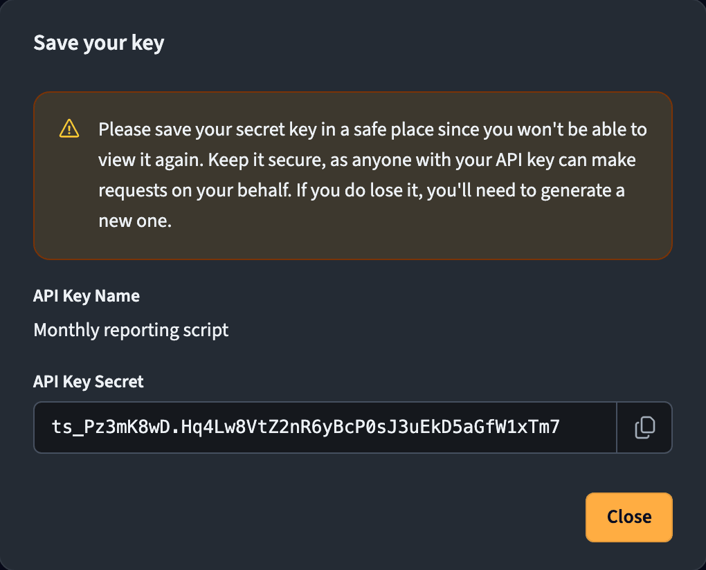 Generated API key secret shown once with a copy button