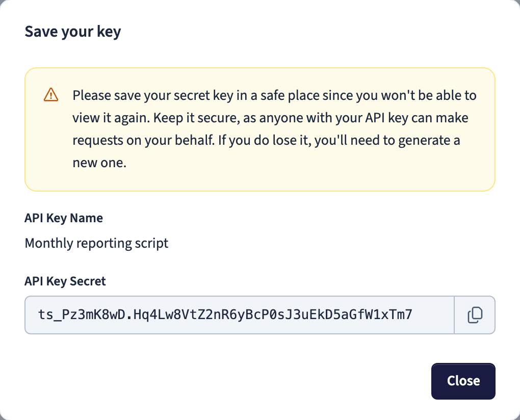 Generated API key secret shown once with a copy button