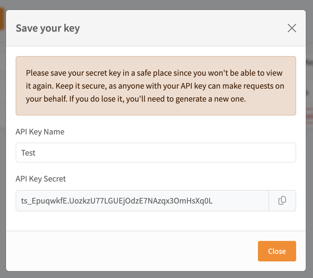 Generated API key secret shown once with a copy button